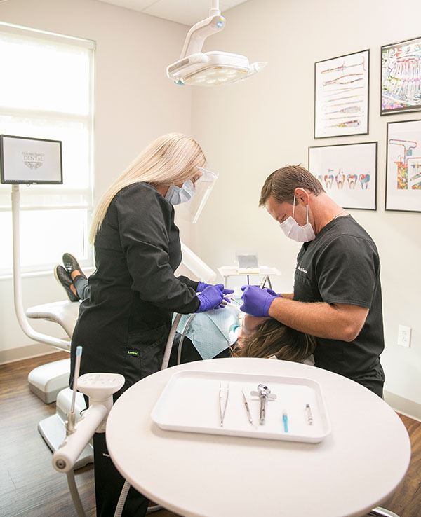 Dentists working on a patient